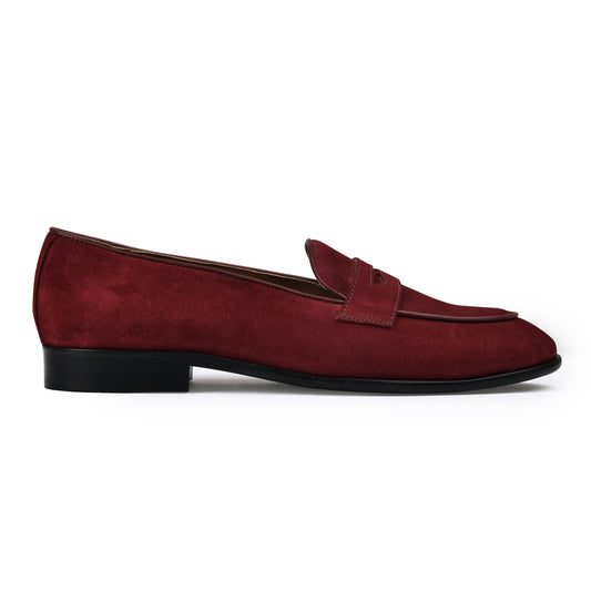 Maroon loafer shoe on a white background