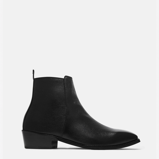 A single black leather ankle boot with a low block heel and pointed toe, shown in profile against a light gray background.