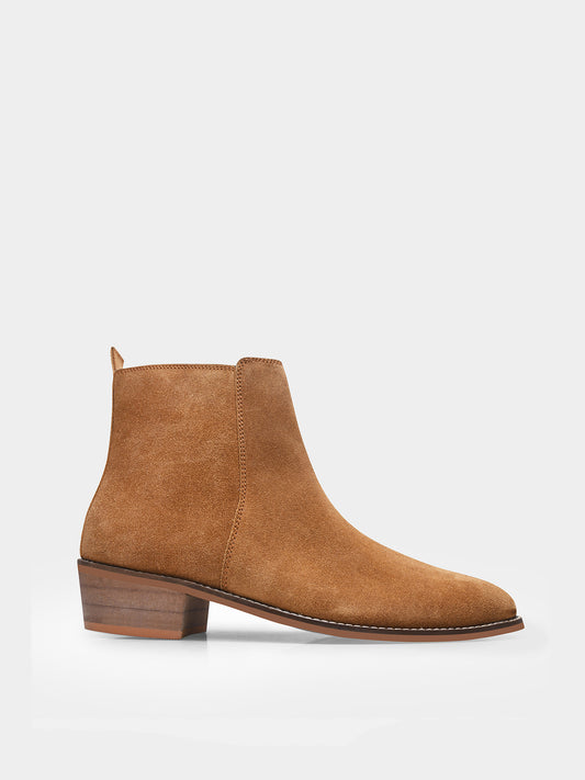 A men's luxury suede leather Chelsea boot with a cuban heel and zip side panels, in a camel color.