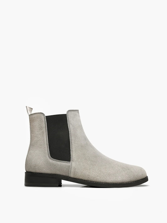 A men's luxury suede leather Chelsea boot with a cuban heel and elastic side panels, in a gray color.