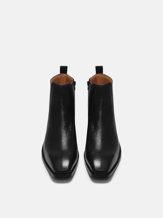 A men's leather side zip boot with a cuban heel, primarily black in color.