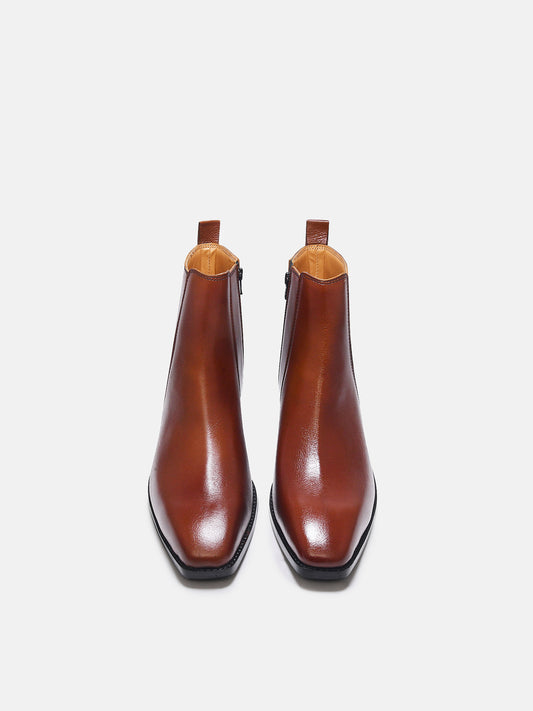 A men's side zip leather boot with a tan finish and a cuban heel.