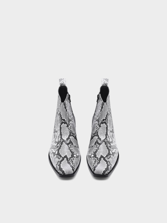 A pair of black and white snake printed leather boot with square toe and a black colour Cuban heel