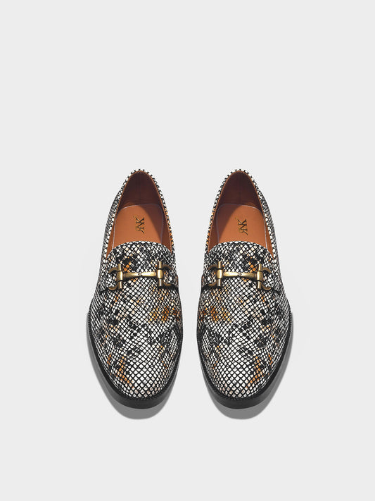 Pair of patterned loafers with a horsebit buckle