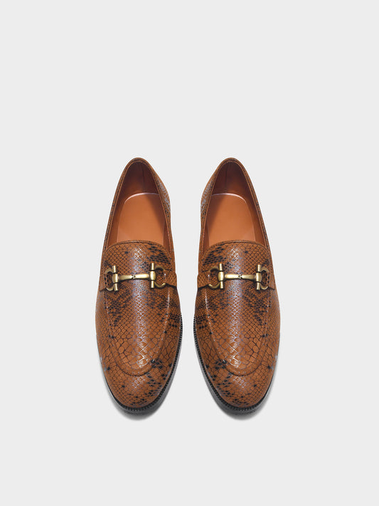 Brown snake-patterned penny loafer shoe on mid heel with a horsebit buckle