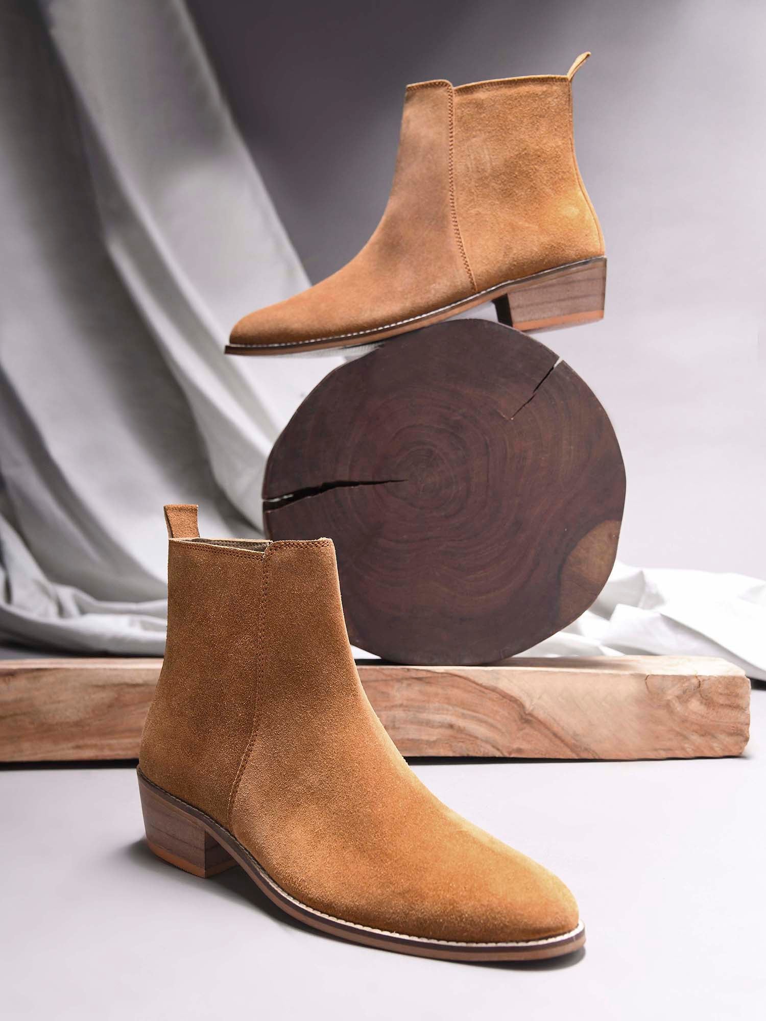 A men's luxury suede leather Chelsea boot with a cuban heel and zip side panels, in a camel color.