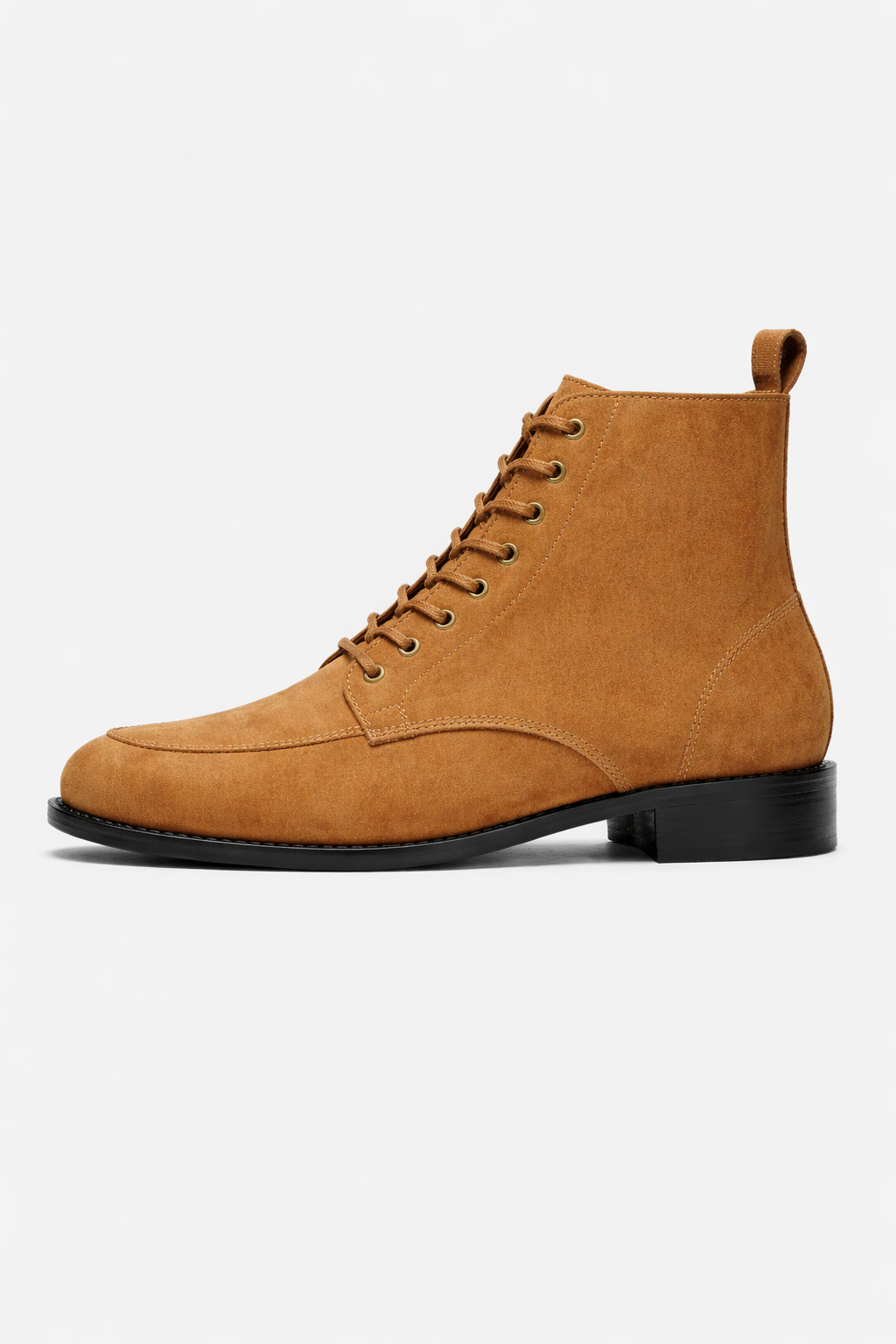 Tan suede boot with black sole on a white background