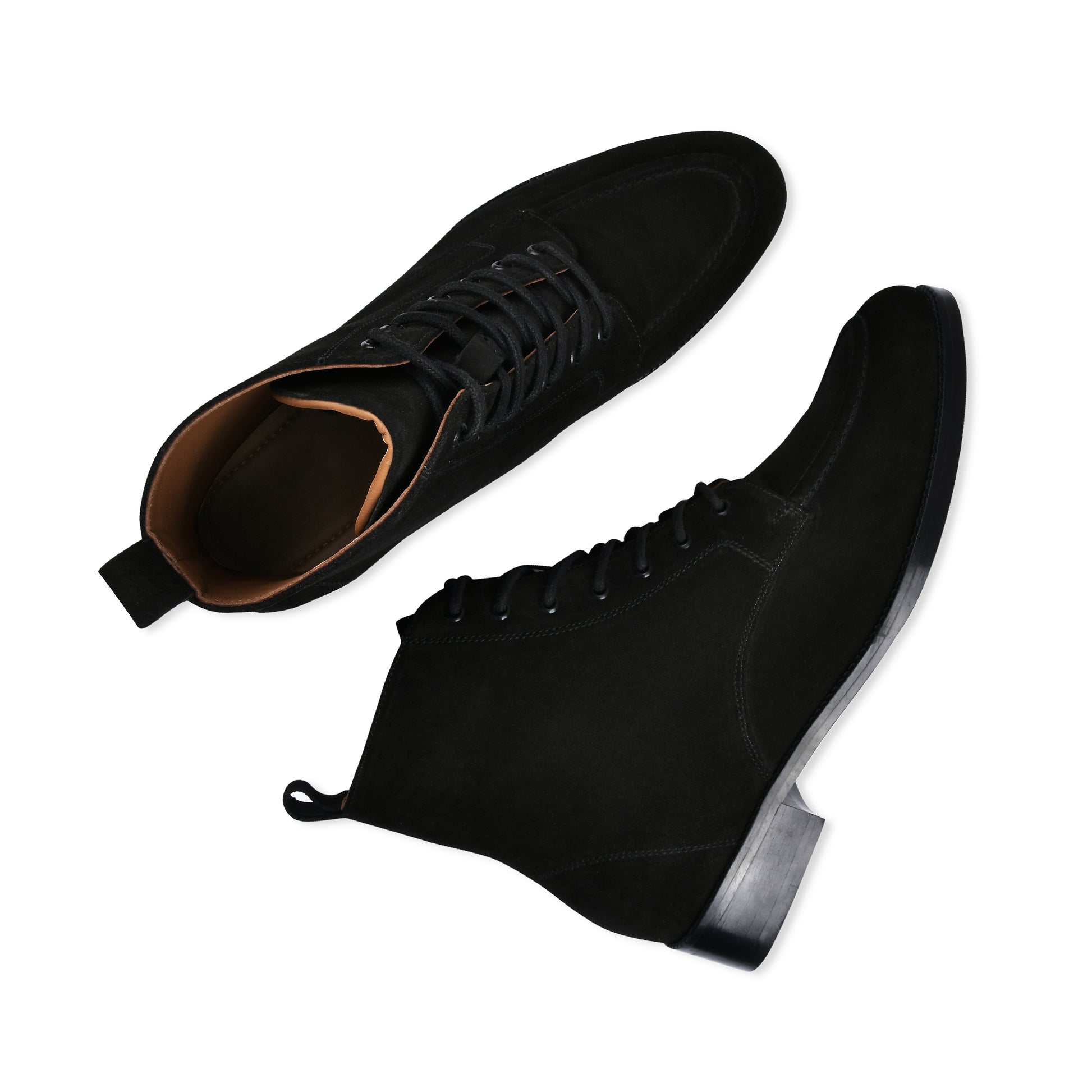 Black suede shoes with laces on a white background