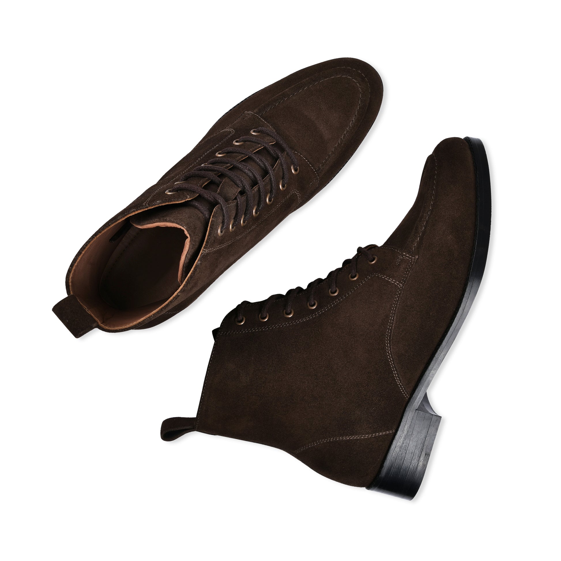 Pair of brown suede shoes on a white background