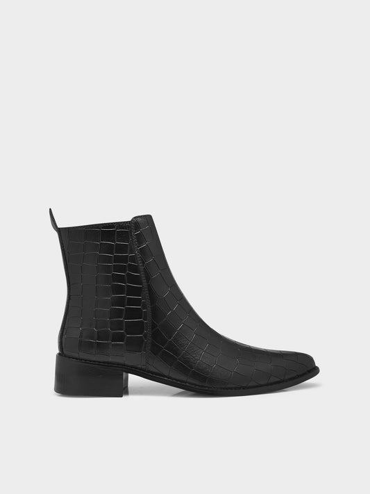 Men’s black crocodile-textured leather Chelsea boots with a sleek, pointed toe design