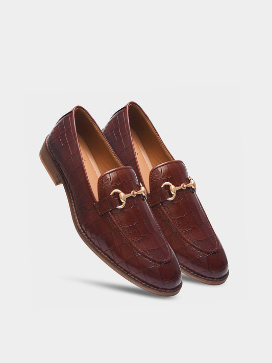 Tan leather horsebit loafers in crocodile texture