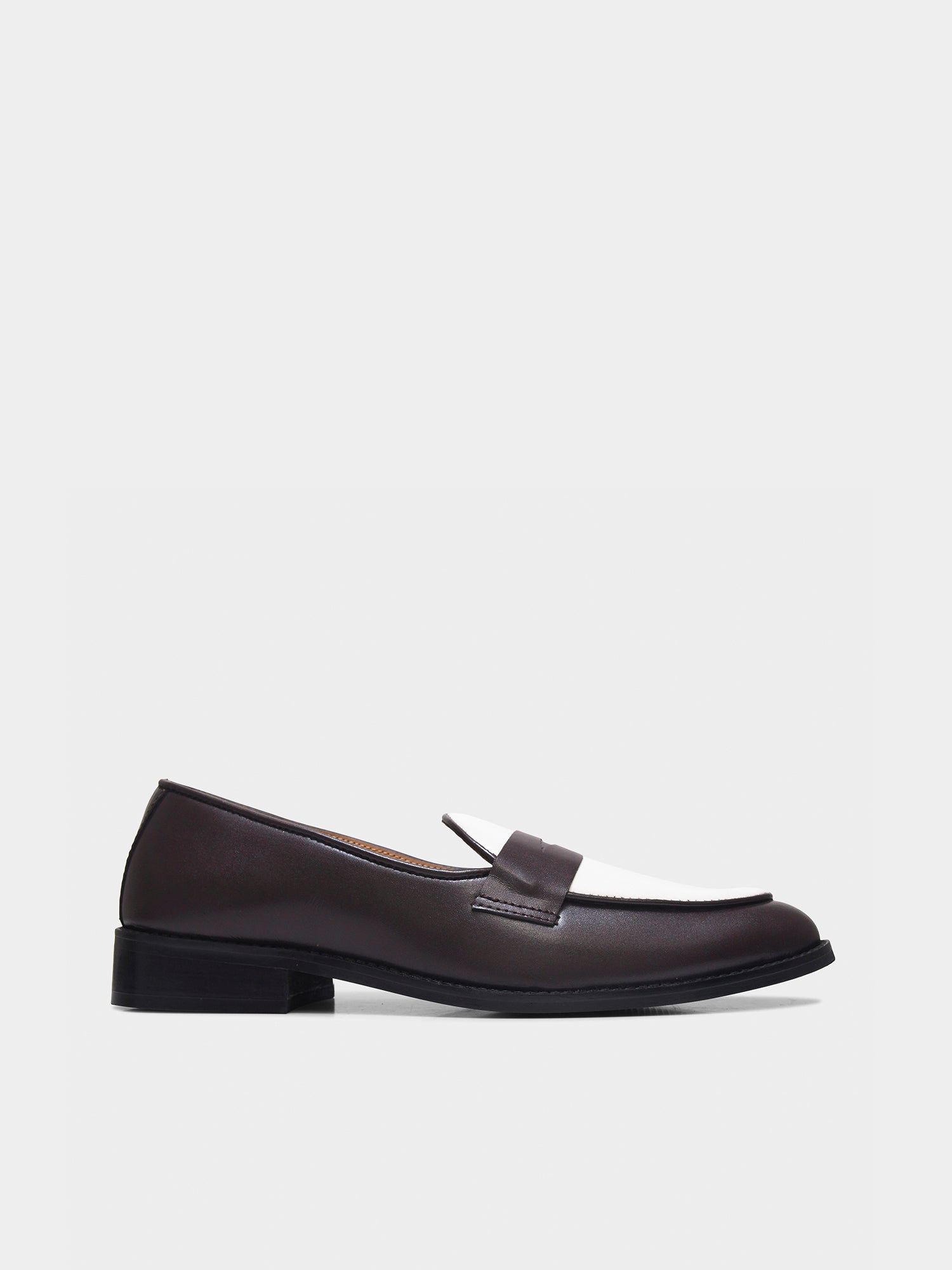 Brown loafer shoe on a light gray background