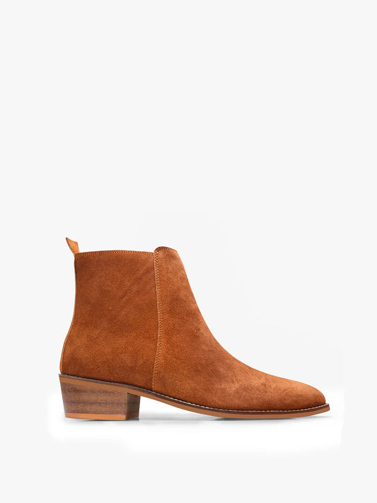 A men's luxury suede leather Chelsea boot with a cuban heel and zip side panels, in a tan color.