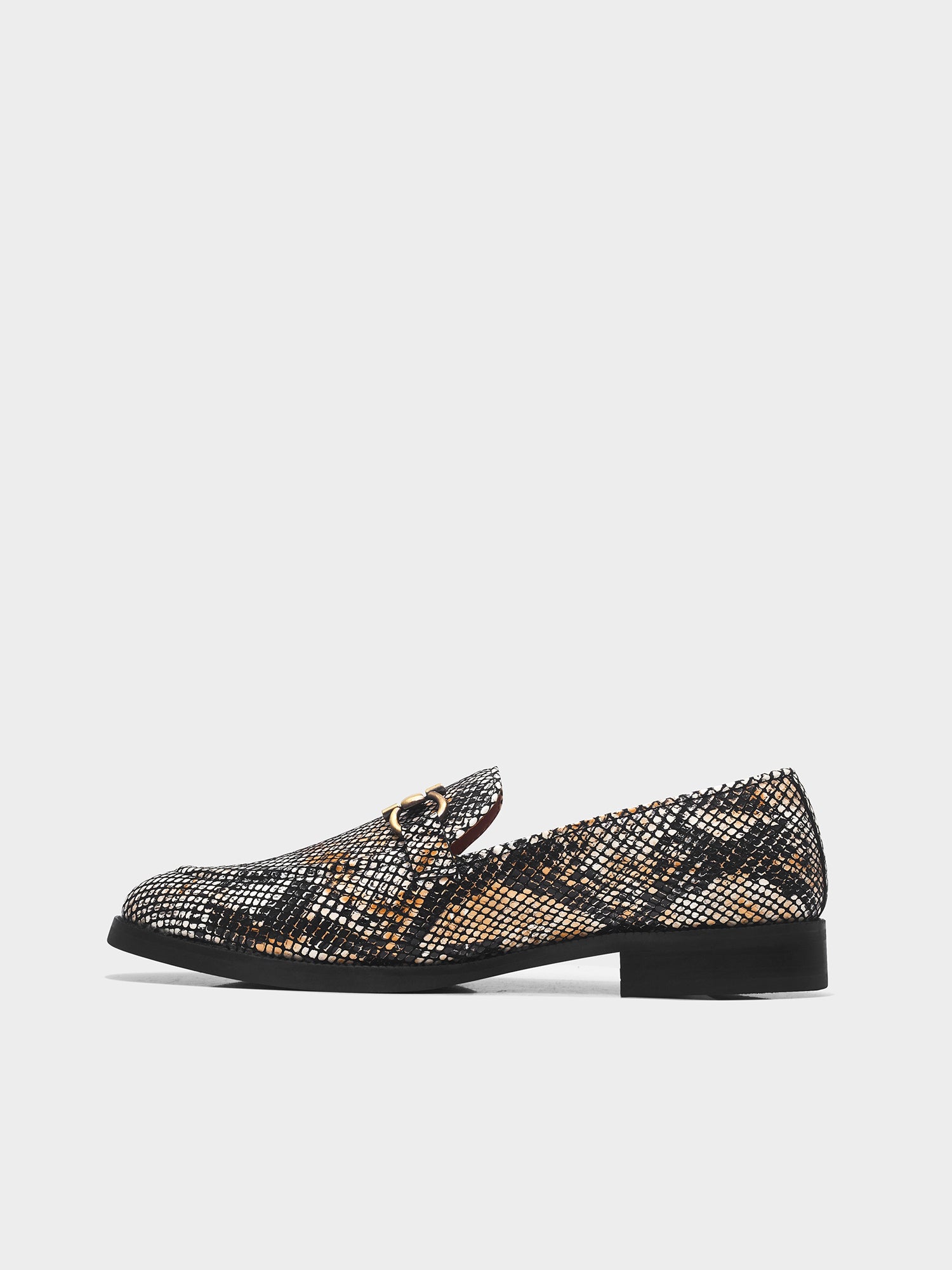 Golden and black snake-patterned penny loafer shoe on mid heel with a horsebit buckle
