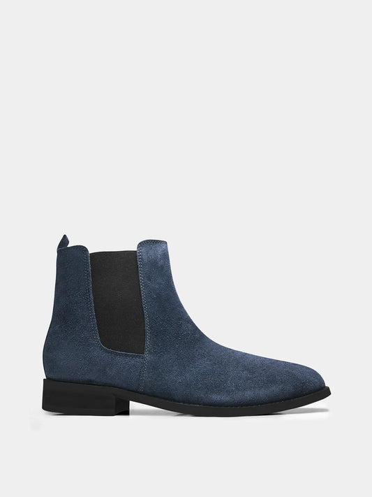 A men's luxury suede leather Chelsea boot with a cuban heel and elastic side panels, in a blue color.
