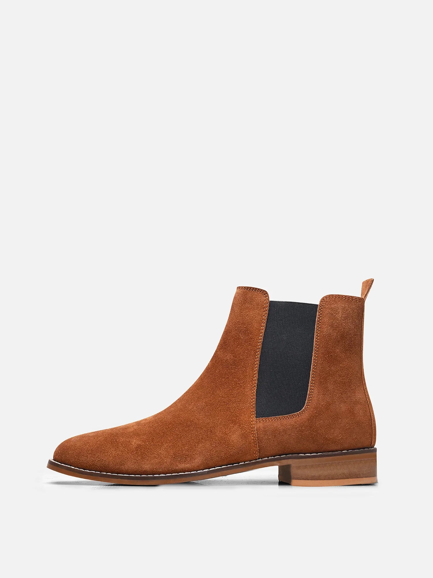 A men's luxury suede leather Chelsea boot with a mid heel and elastic side panels, in a tan color.