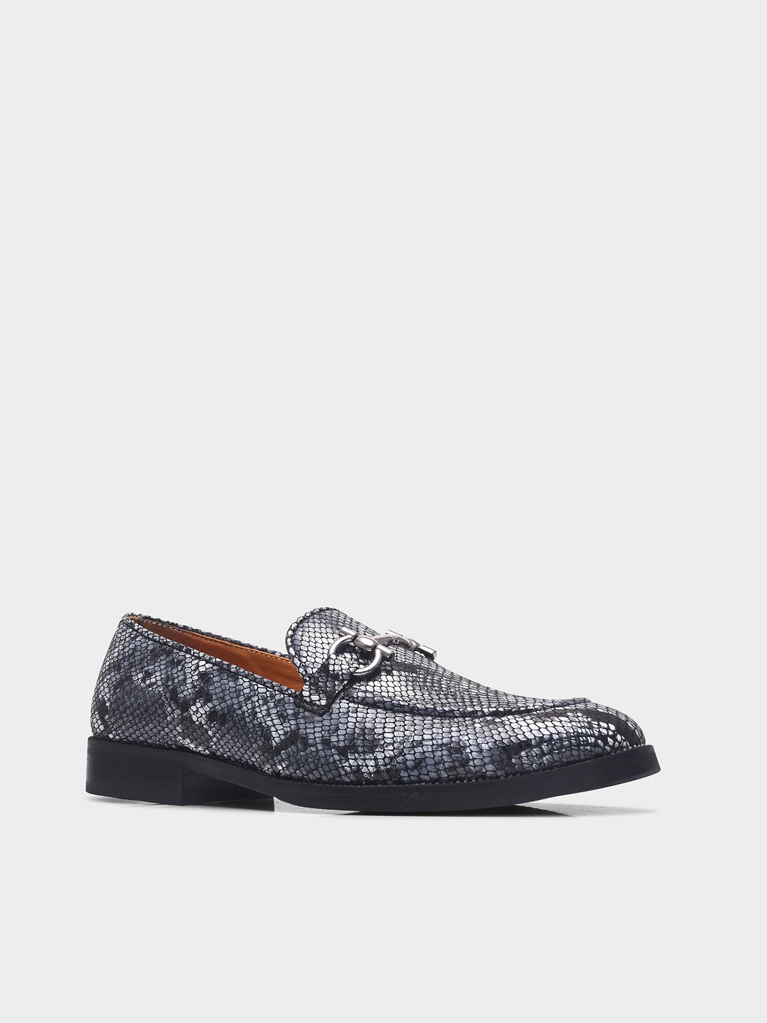 Black and white snake-patterned penny loafer shoe on mid heel with a horsebit buckle