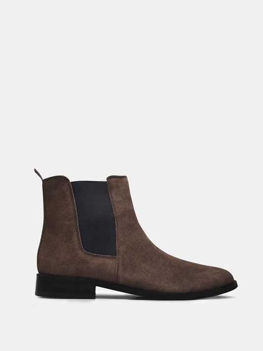 A men's luxury suede leather Chelsea boot with a mid heel and elastic side panels, in a brown color.