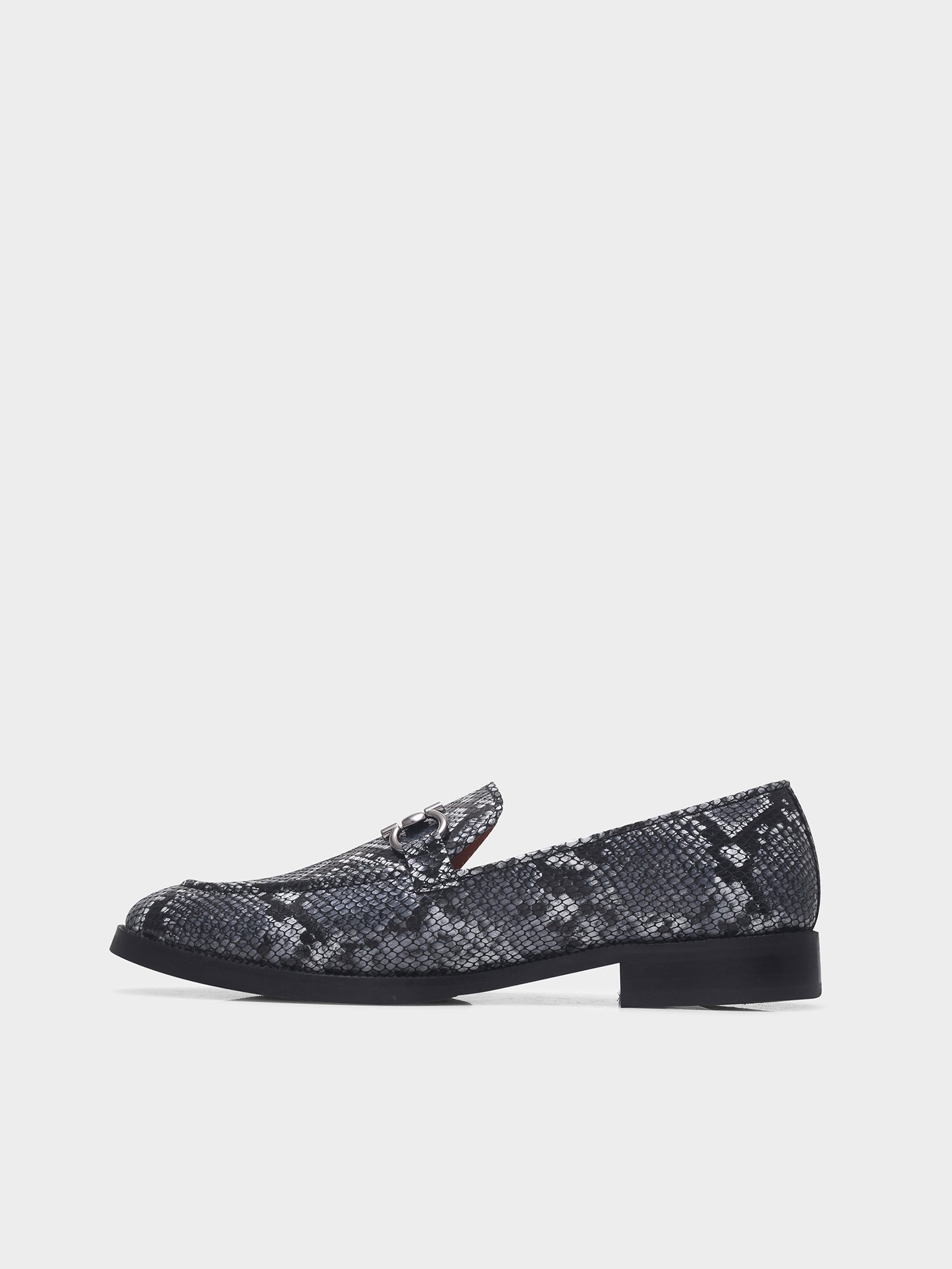 Black and white snake-patterned penny loafer shoe on mid heel with a horsebit buckle