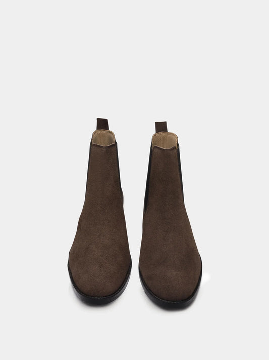 A men's luxury suede leather Chelsea boot with a mid heel and elastic side panels, in a brown color.