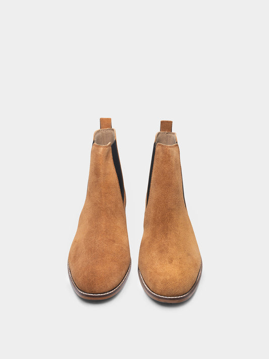 A men's luxury suede leather Chelsea boot with a mid heel and elastic side panels, in a tan color.