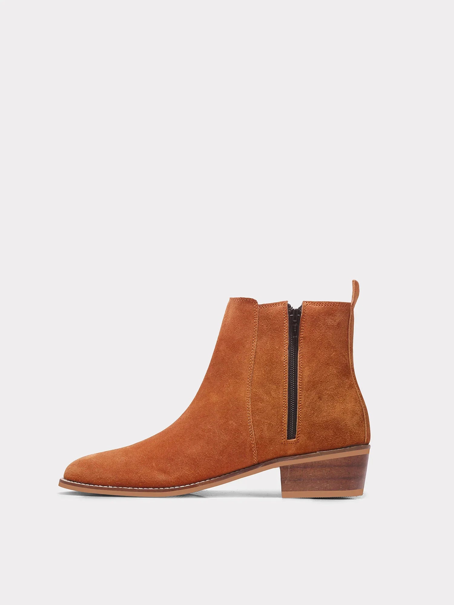 A men's luxury suede leather Chelsea boot with a cuban heel and zip side panels, in a tan color.