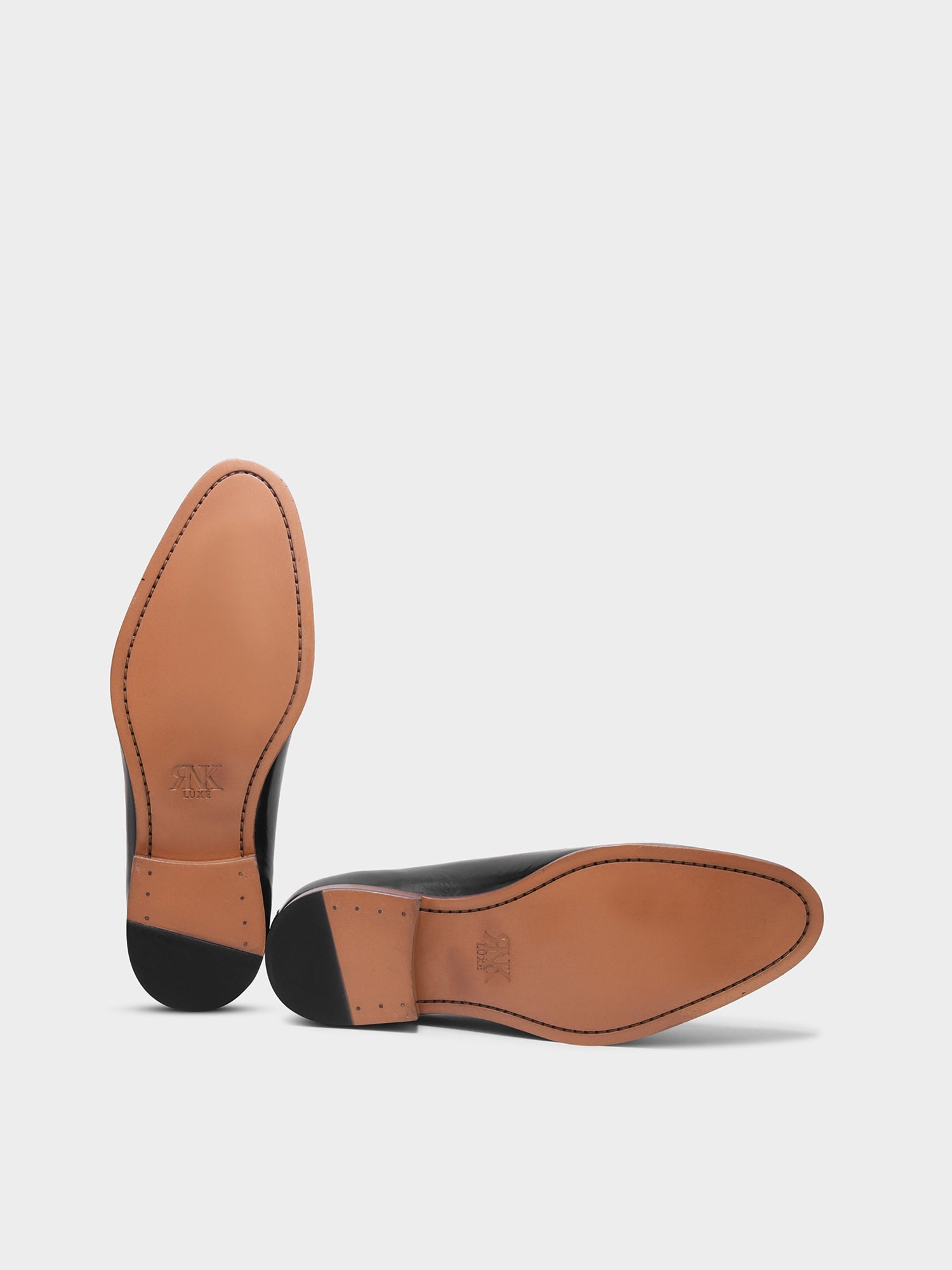 Close-up of a brown leather shoe sole on a white background