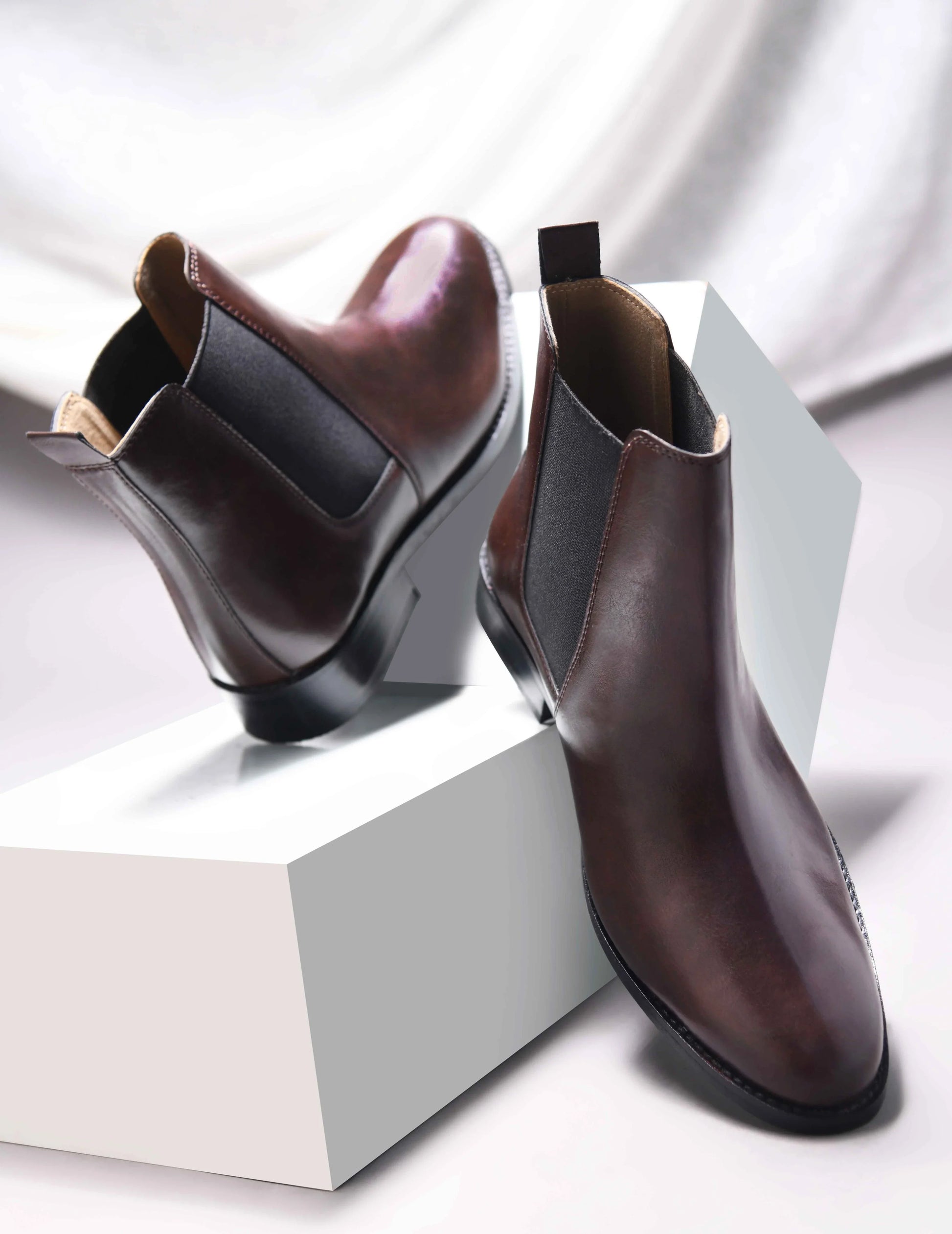 Brown leather Chelsea boot with side elastic and mid heel
