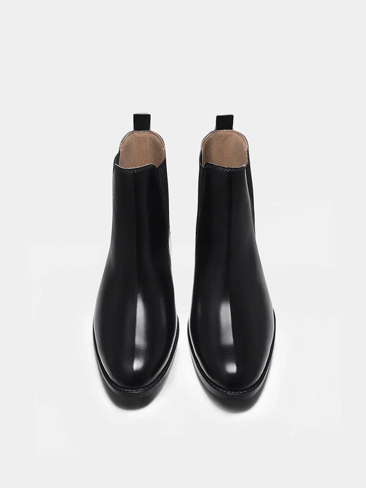 Pair of black Chelsea boots with side elastic