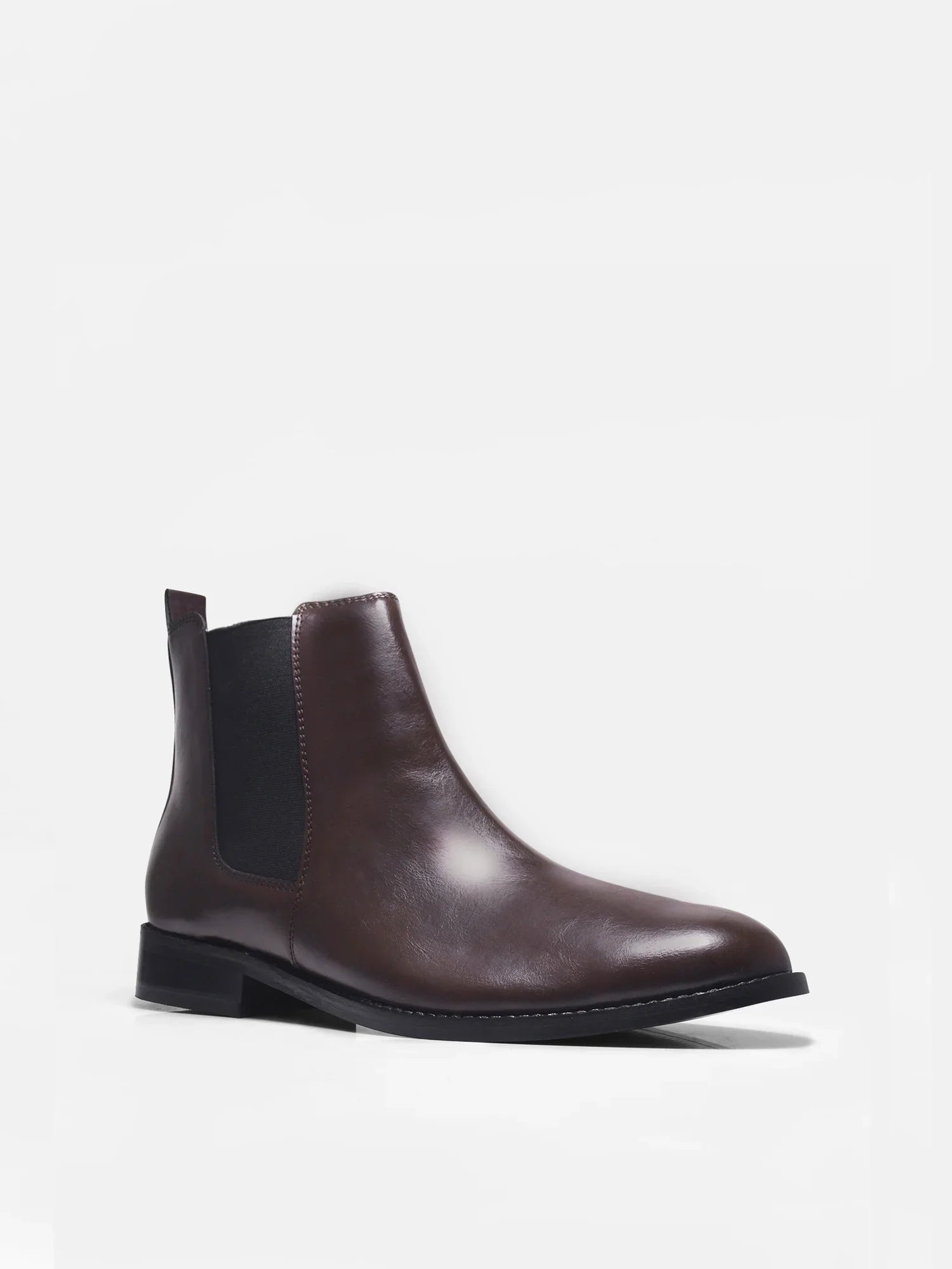 Brown leather Chelsea boot with side elastic and mid heel on a white background