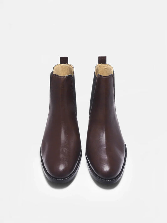 Brown leather Chelsea boot with side elastic and mid heel on a white background