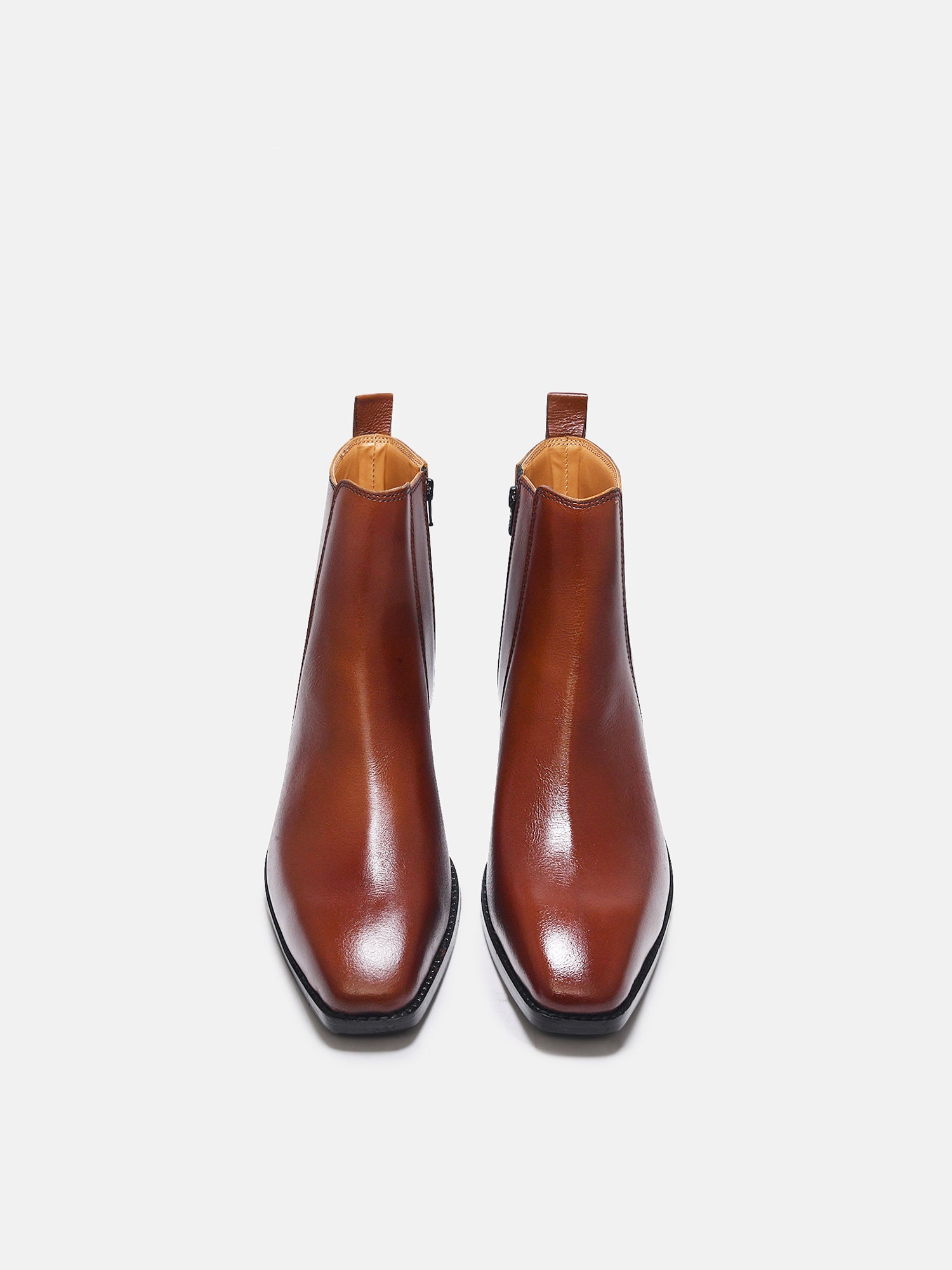 A men's side zip leather boot with a tan finish and a cuban heel.
