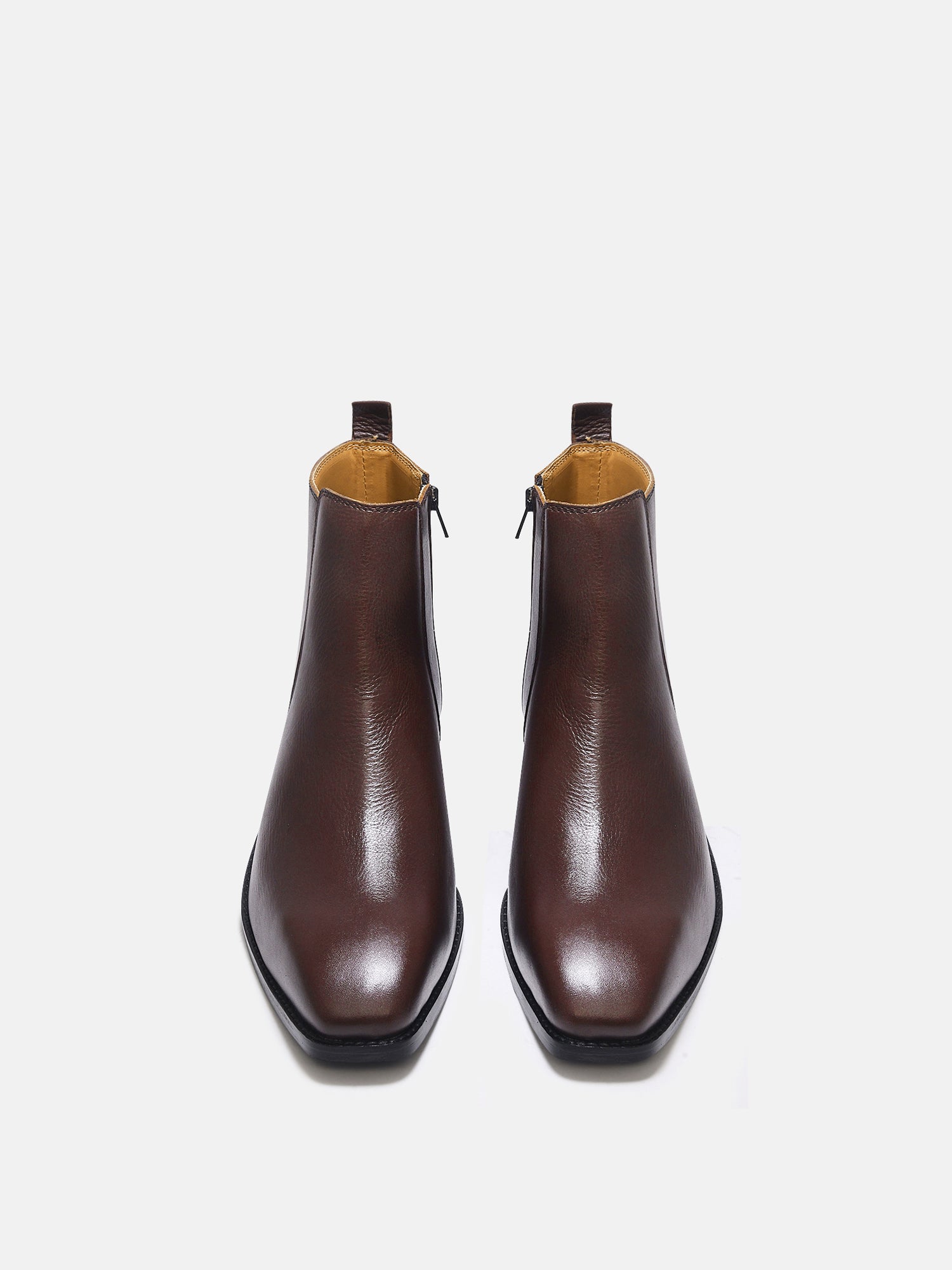 A brown, side zip leather boot with a cuban heel for men.