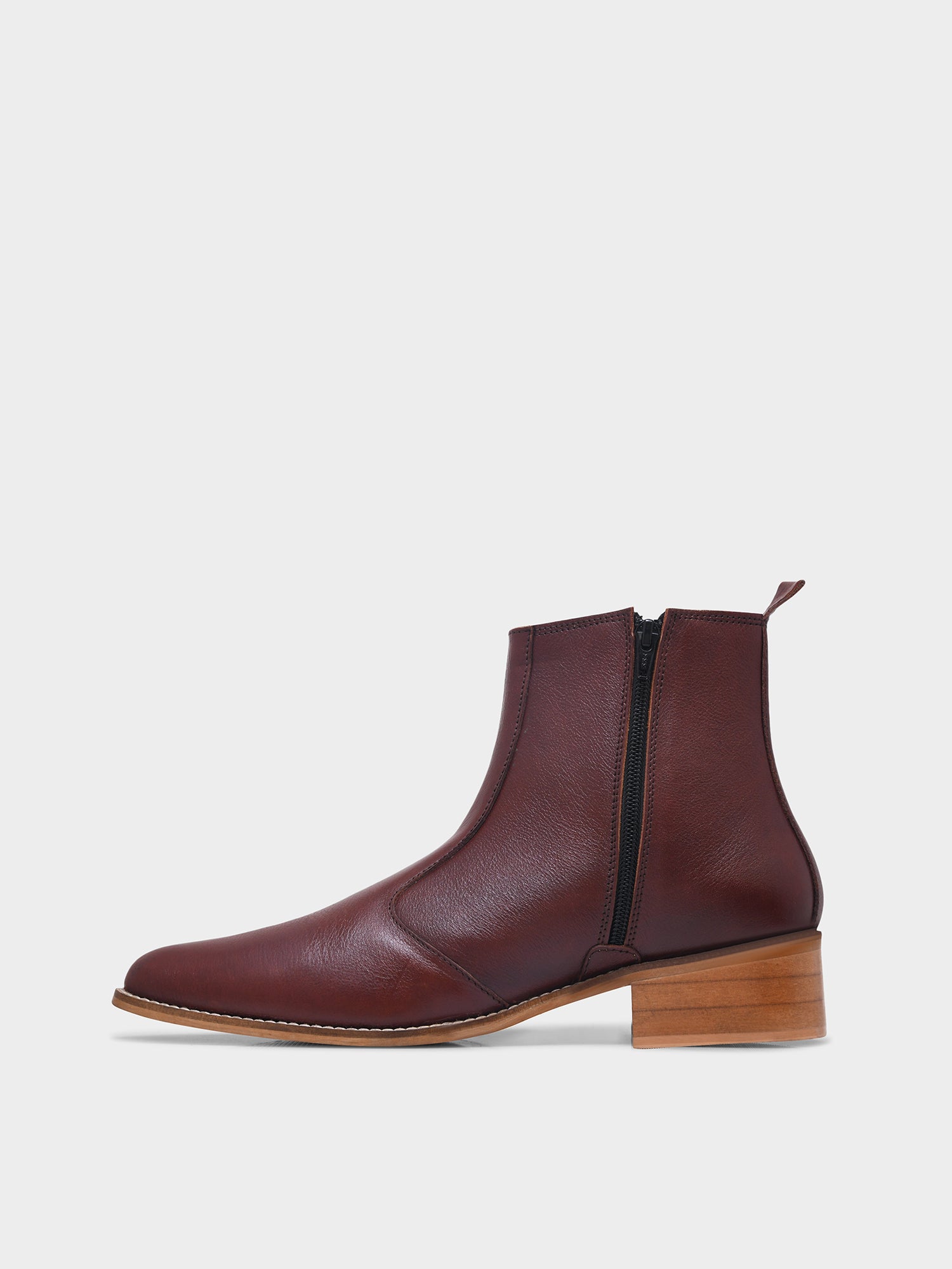 Brown leather ankle boot with wooden heel on a light gray background