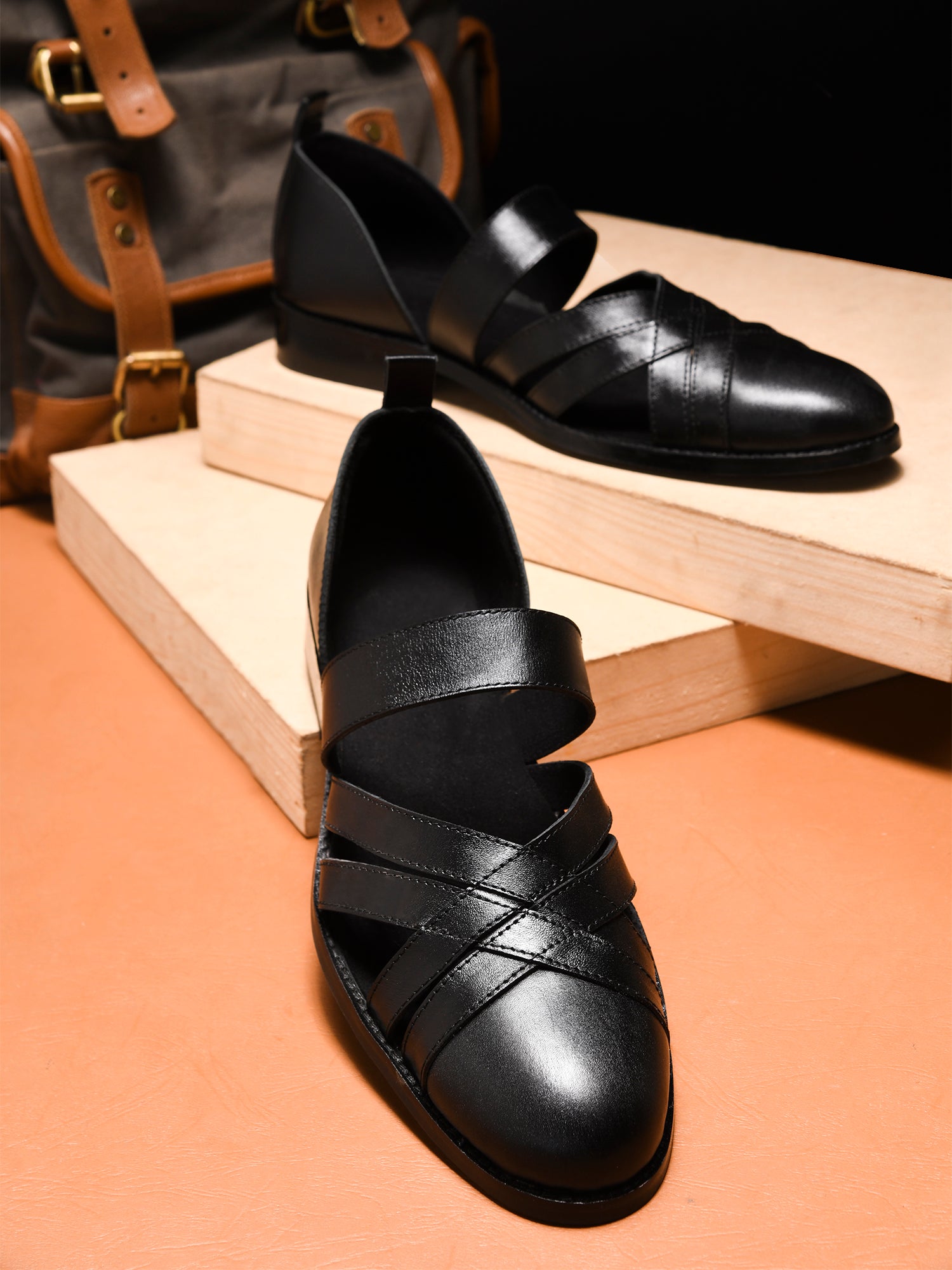 Handcrafted black leather sandals for men with interwoven straps