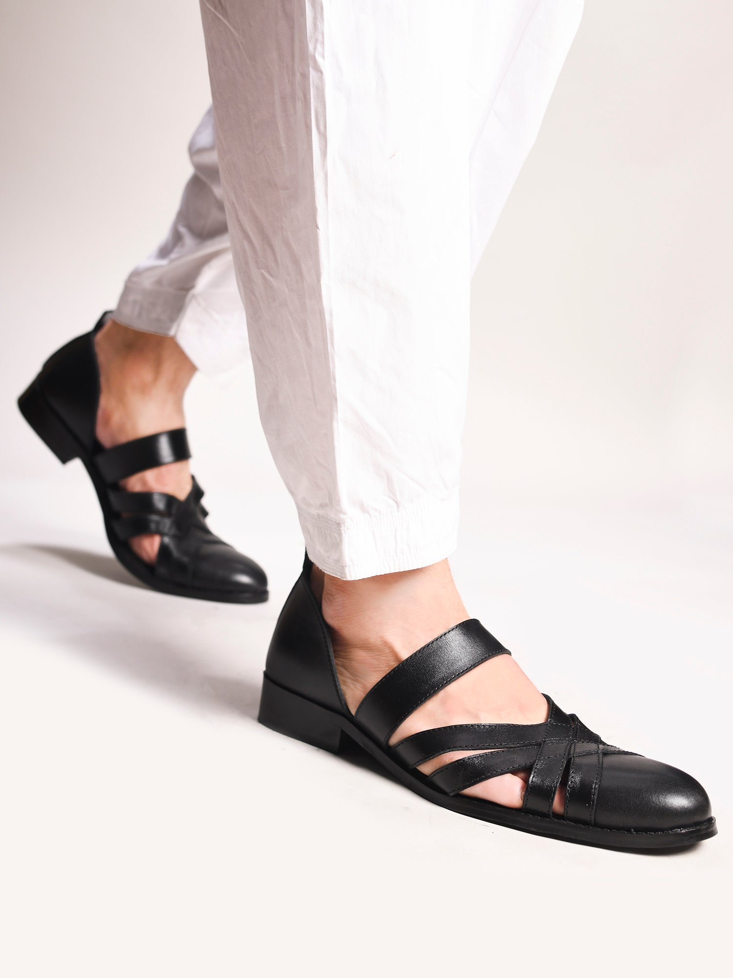 Handcrafted black leather sandals for men with interwoven straps