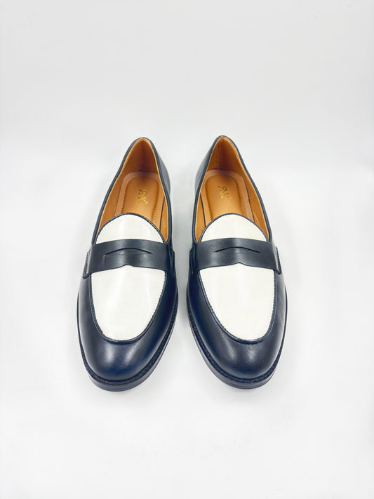 Black and white leather loafers on a mid heel 