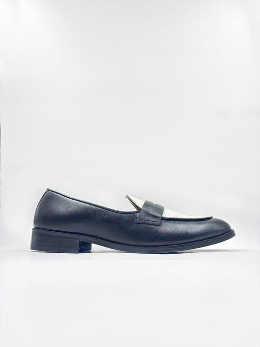 Black and white leather loafers on a mid heel 