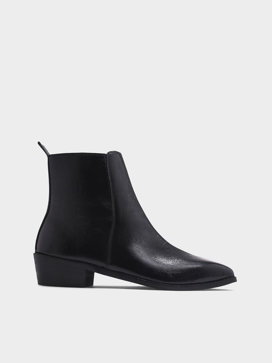 Black patent leather boots with side zipper on a Cuban heel