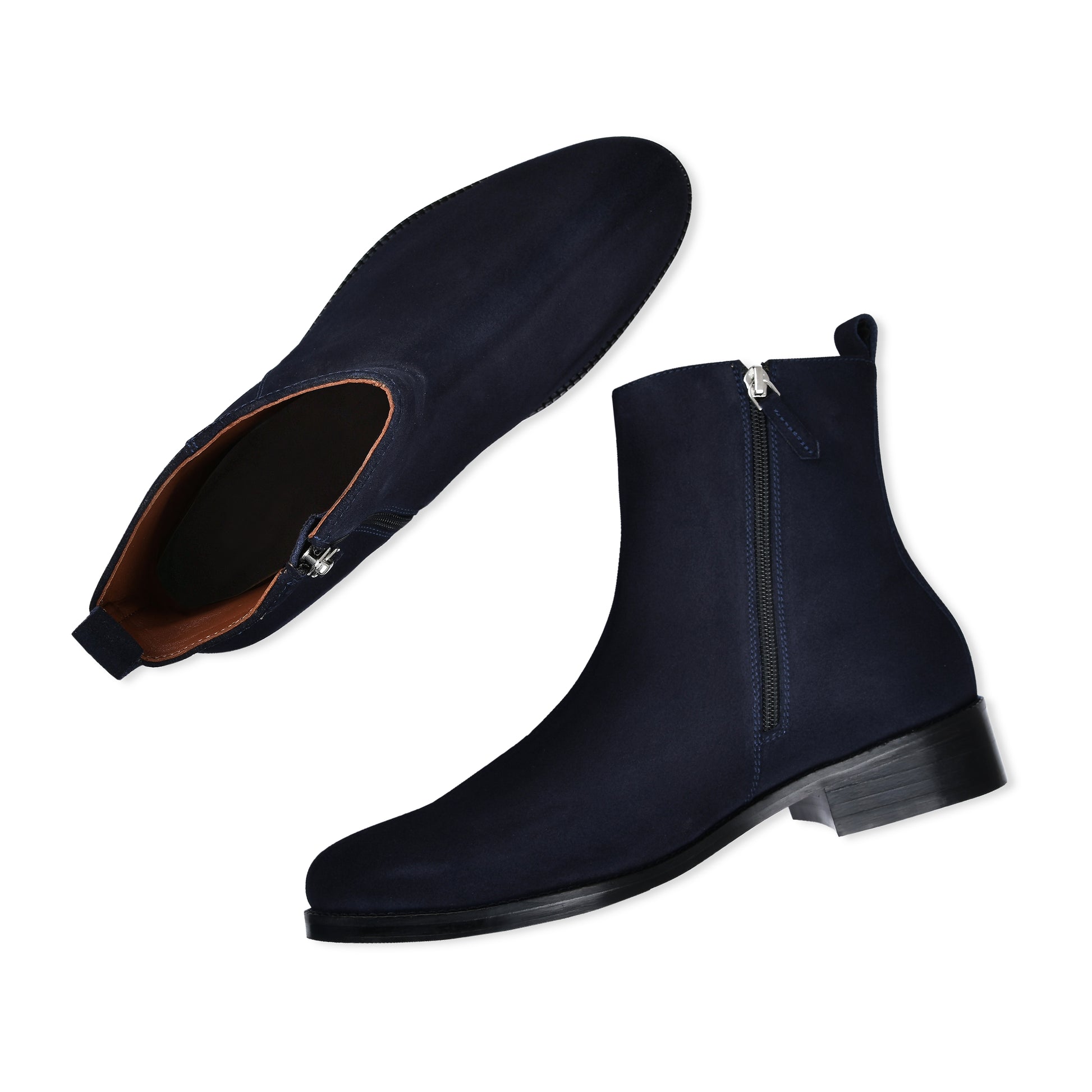 Navy blue Chelsea boots with a zipper on a white background