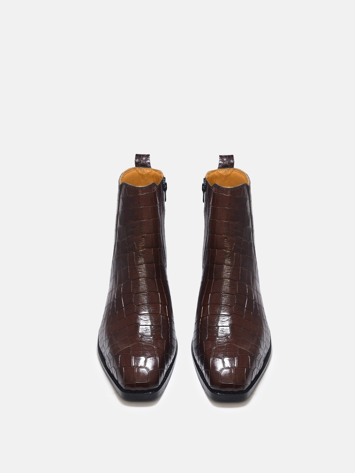 A brown leather side zip boot with a crocodile pattern and a Cuban heel.