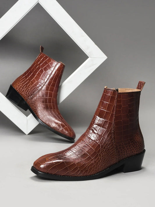 Pair of tan colour crocodile textured leather boots with side zip on a Cuban heel