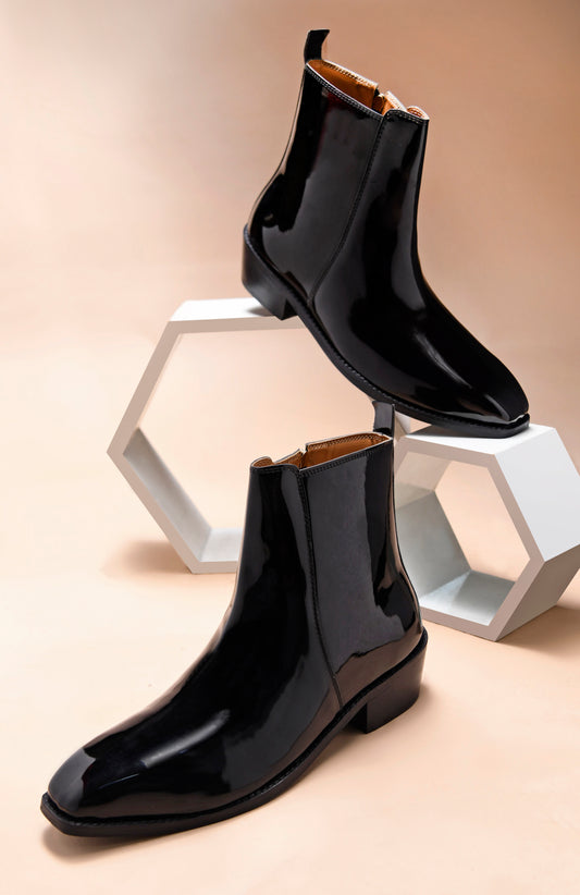A man's patent leather boot in black or a Cuban heel