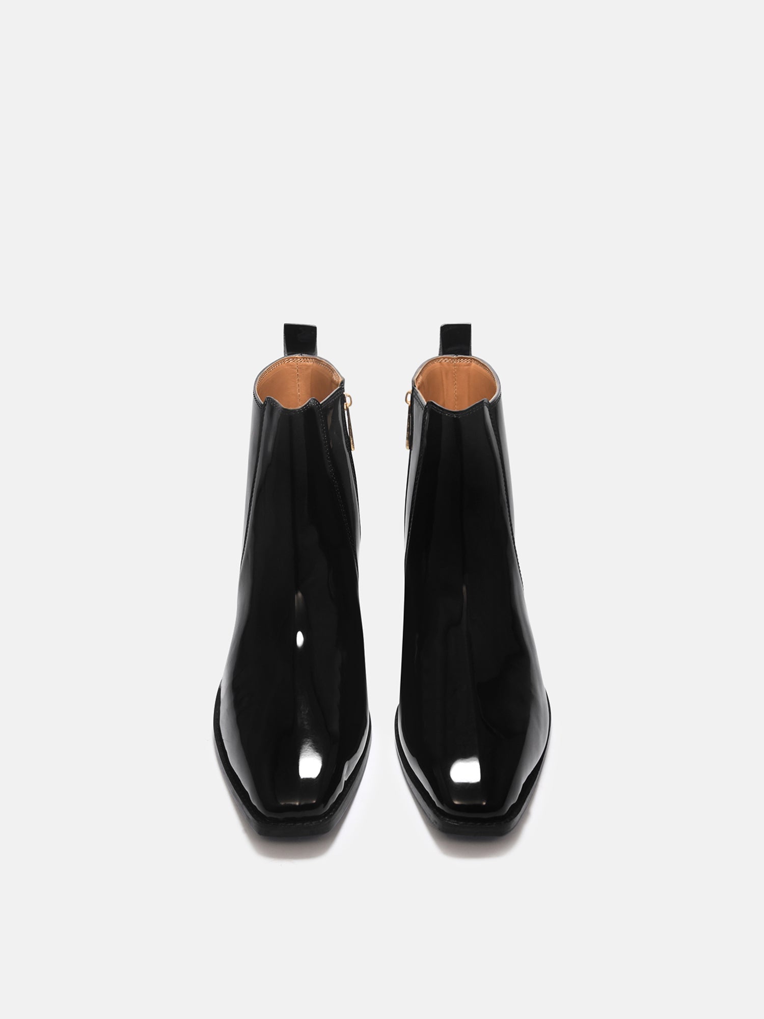 A man's patent leather boot in black or a Cuban heel