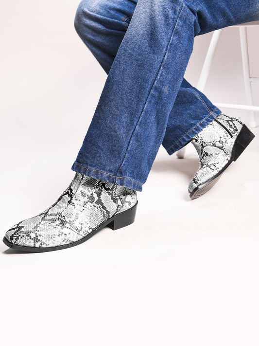 A pair of black and white snake printed leather boot with square toe and a black colour Cuban heel