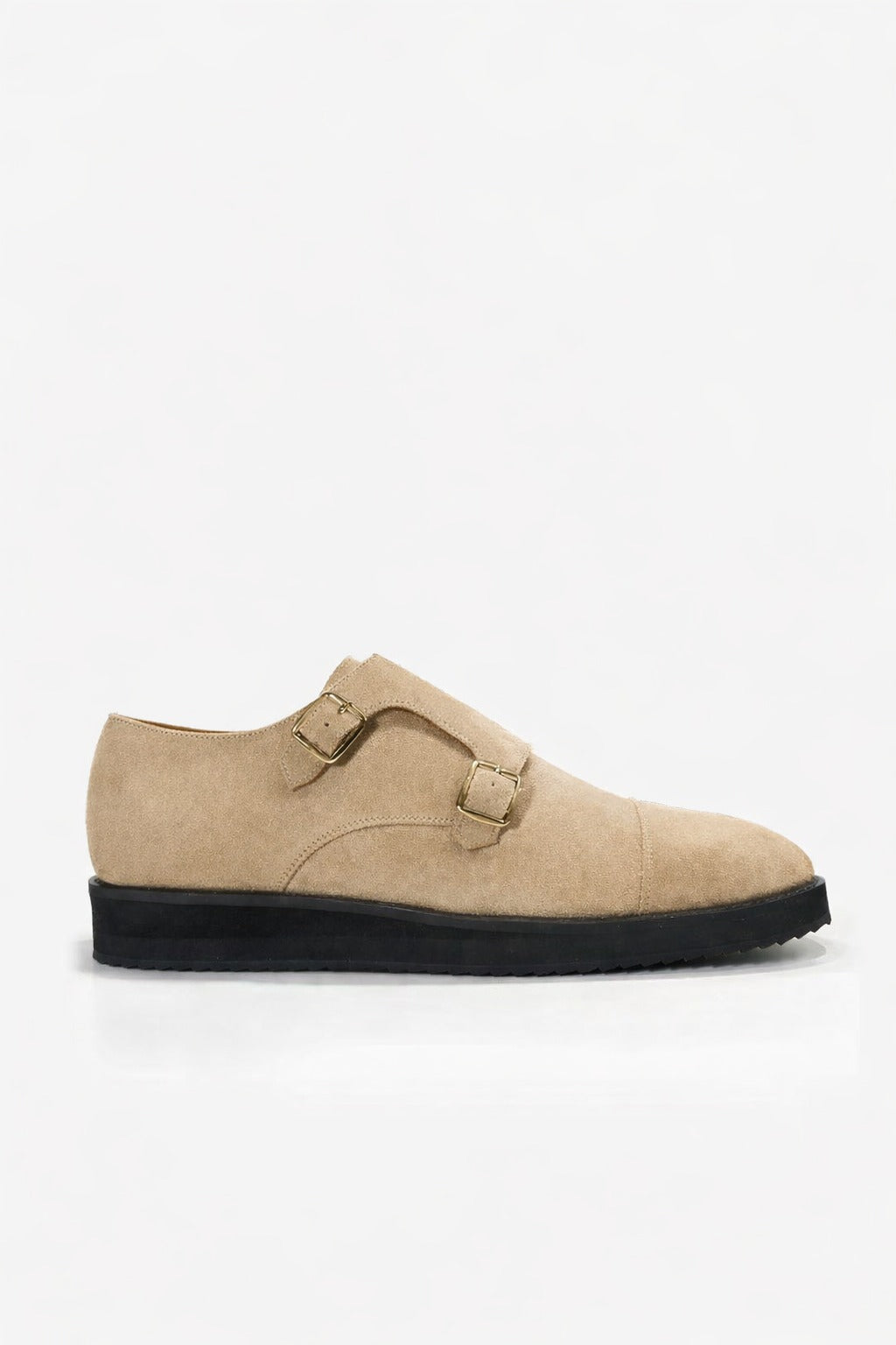 Beige suede shoe with a black sole on a white background
