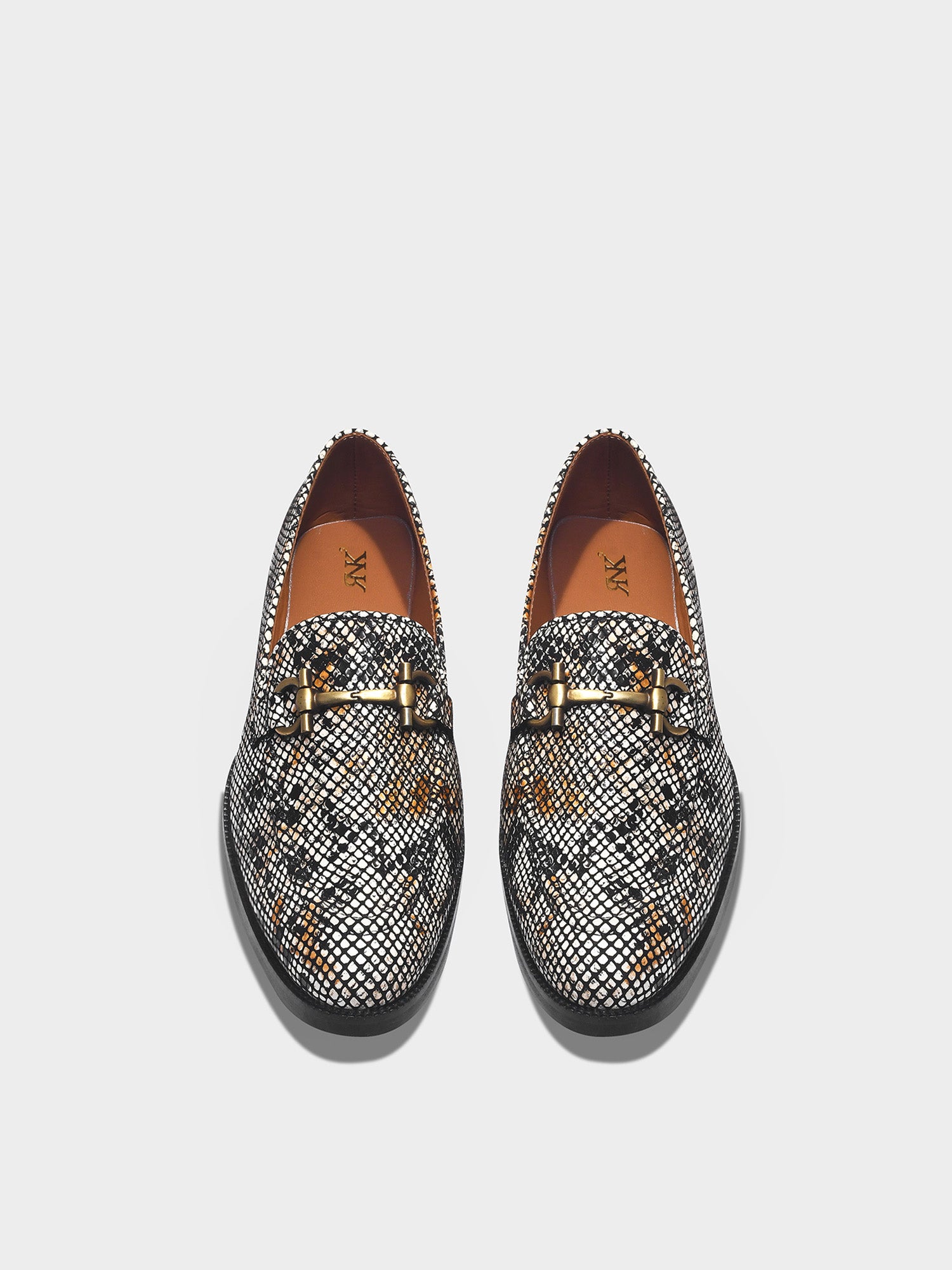 Pair of patterned loafers with a horsebit buckle 