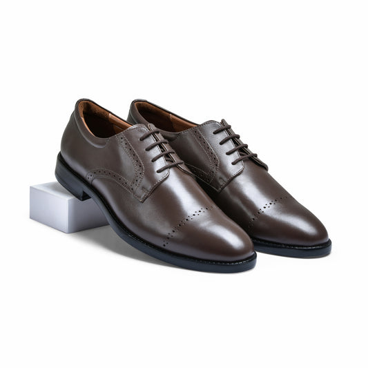 Pair of brown leather dress shoes on a white background