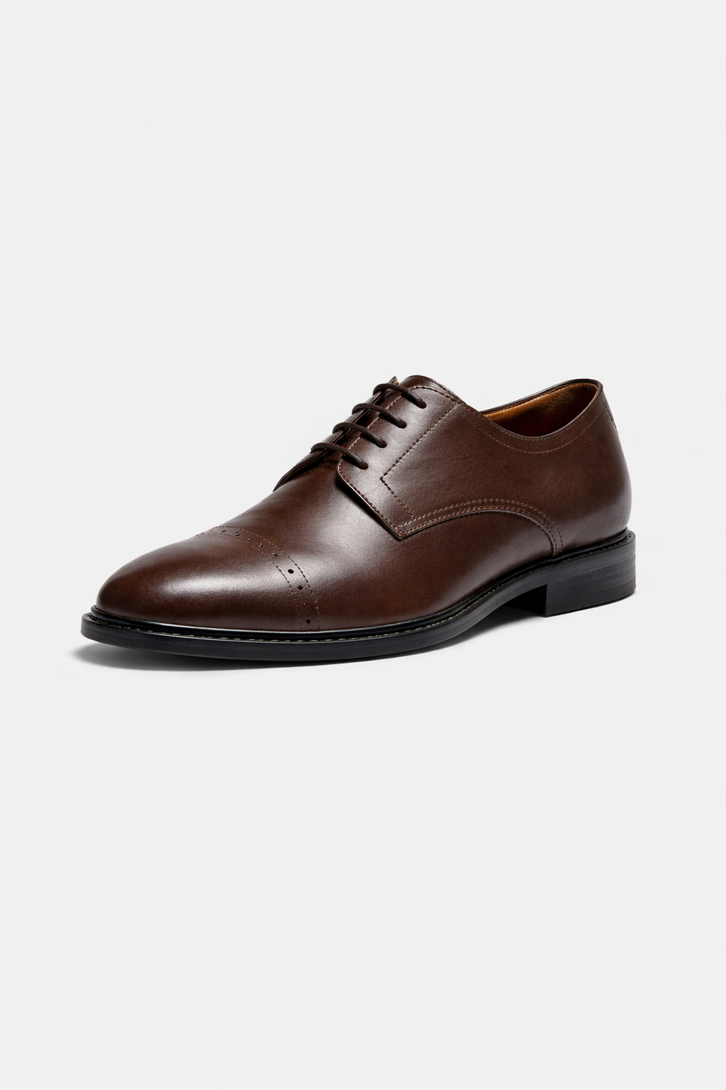 Brown leather dress shoe on a white background