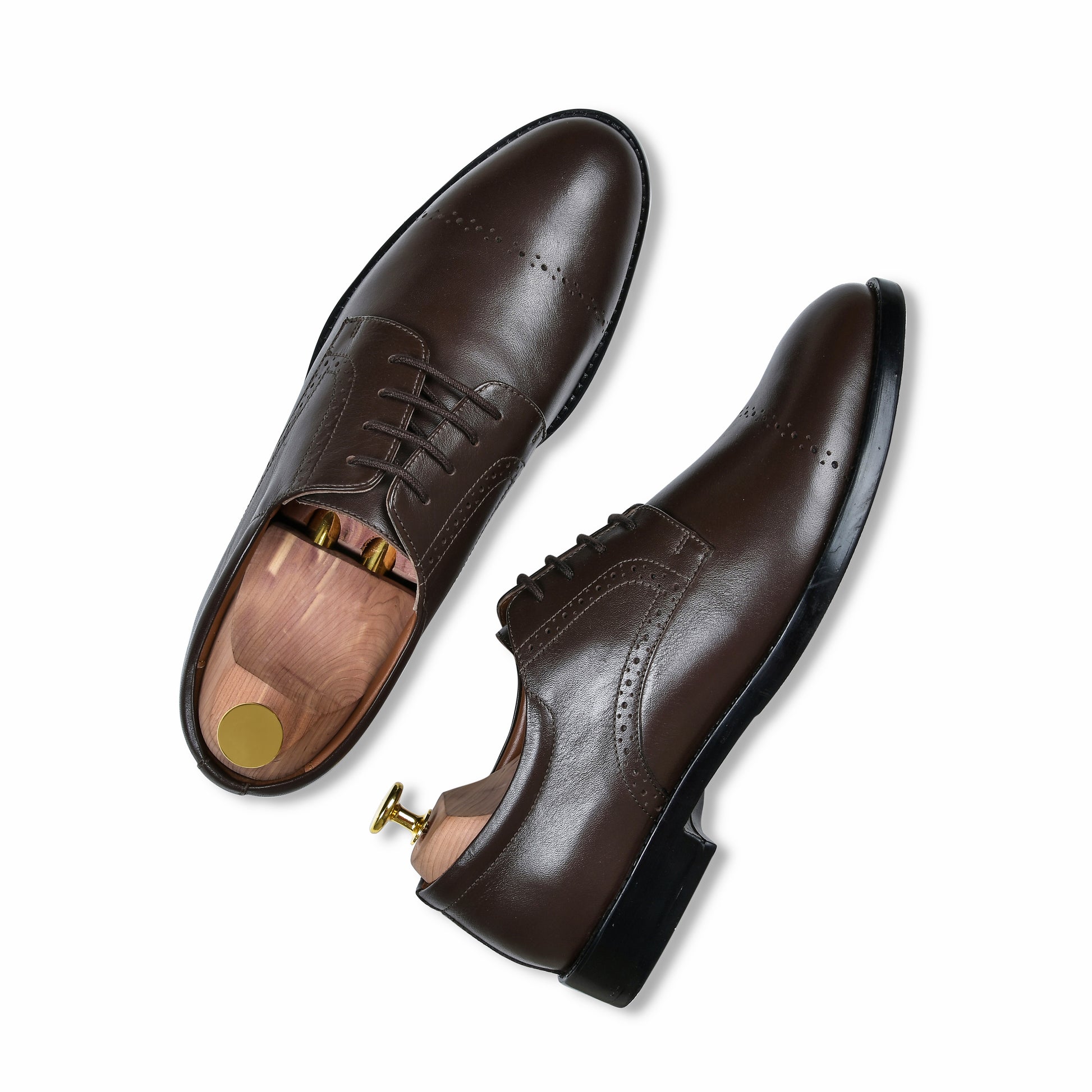 Brown leather dress shoes on a white background
